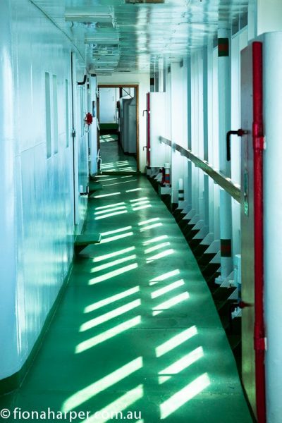 Corridor on Lyubov Orlova bathed in Arctic sunlight
